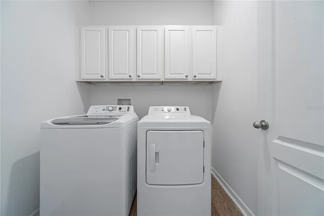 a utility room with dryer and washer