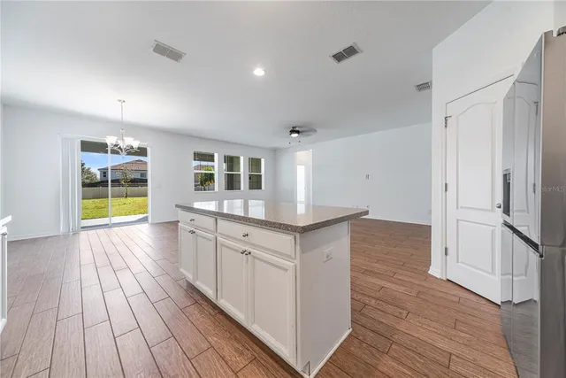 a kitchen with stainless steel appliances granite countertop a stove and a sink