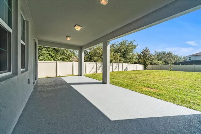 an aerial view of multiple houses with yard