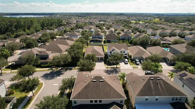 an aerial view of a house with swimming pool
