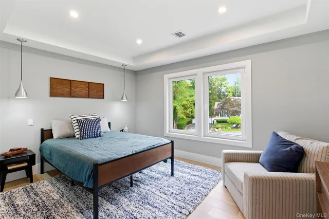 a bedroom with a bed and a couch