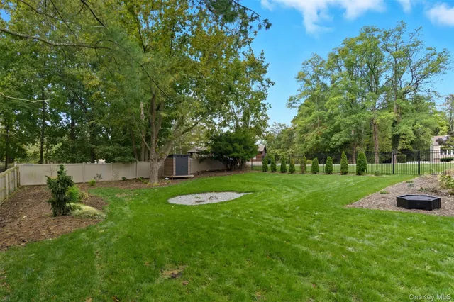 a front view of a house with a yard table and chairs