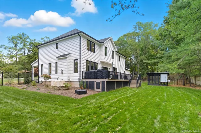 a view of a backyard with sitting area