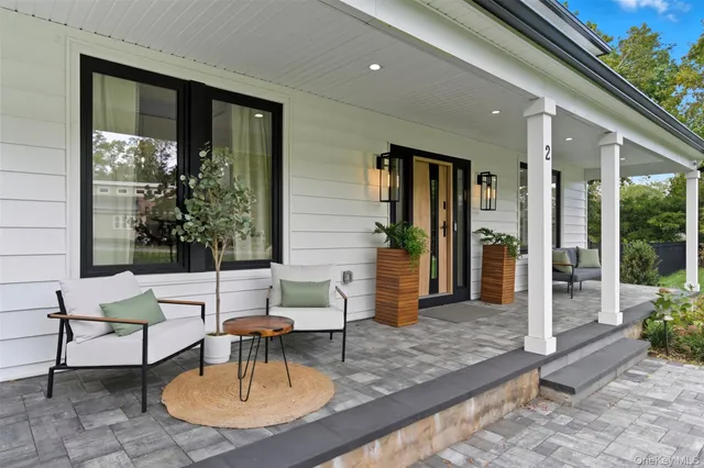 a outdoor space with patio the couches and a dining table with garden view