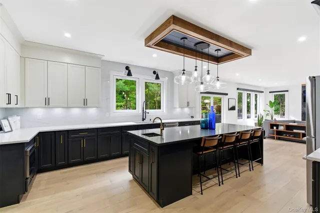 a kitchen with granite countertop a sink and a stove