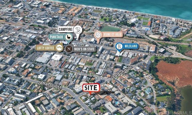 an aerial view of a city with lots of residential buildings