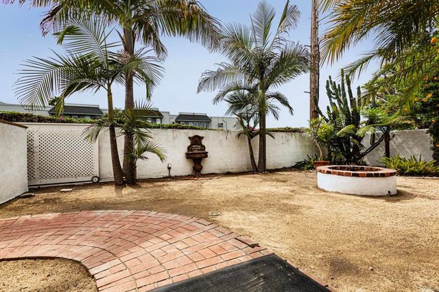 a view of a backyard with palm trees