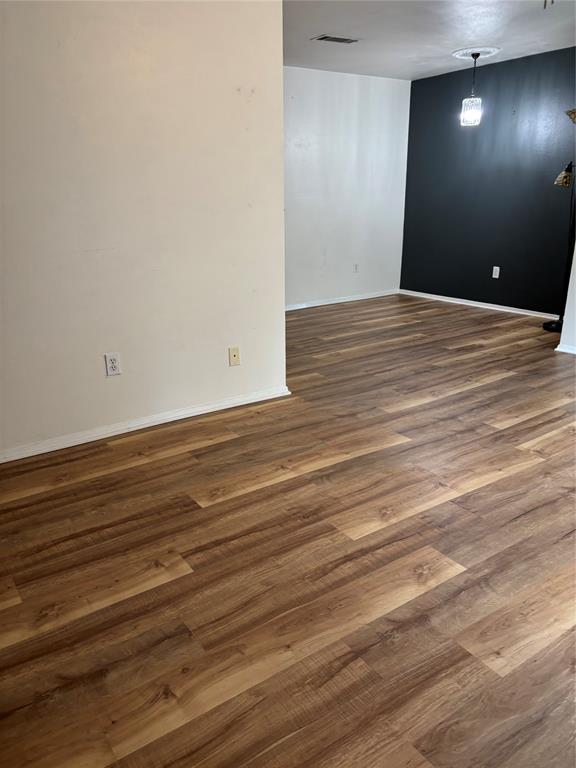 1500 Lake Shore Drive, Unit 213 Waco, TX 76708 - Photo 21 of 21 a view of an empty room with wooden floor