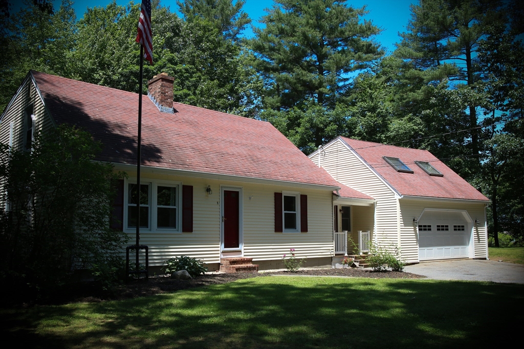 a view of a backyard of the house