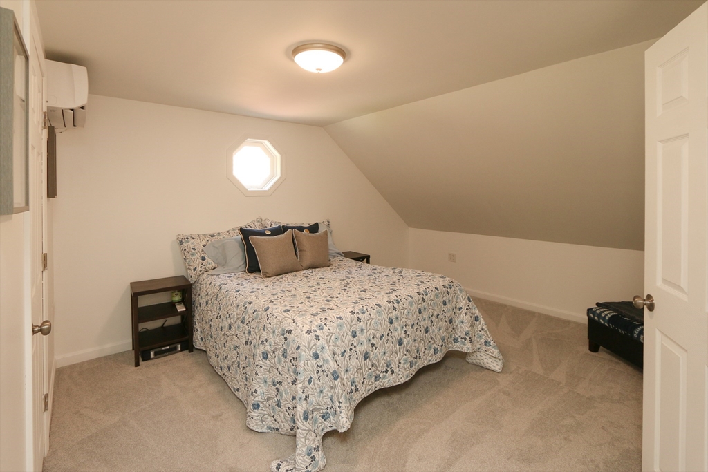 1 Battis Road Merrimac, MA 01860 - Photo 20 of 37 a bedroom with a bed and a lamp with the wooden floor