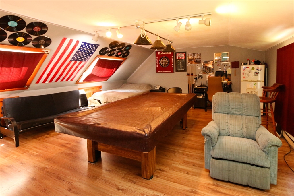 1 Battis Road Merrimac, MA 01860 - Photo 29 of 37 a living room with furniture a rug and a wooden floor