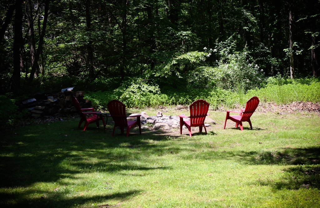 1 Battis Road Merrimac, MA 01860 - Photo 37 of 37 a backyard of a house with table and chairs