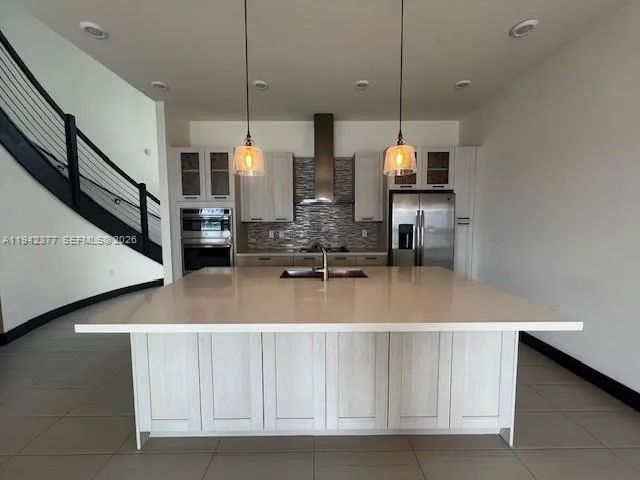 a view of dining room with furniture and wooden floor