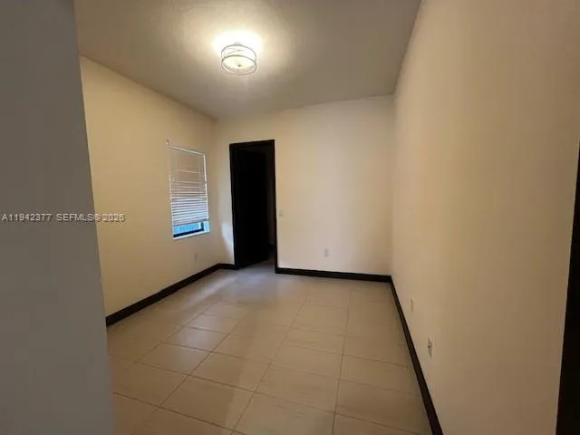 a view of an empty room and window