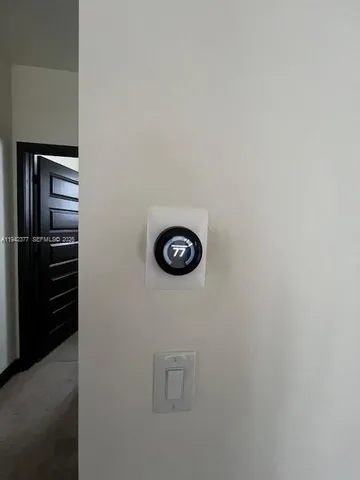 a view of cabinets and a refrigerator in a kitchen
