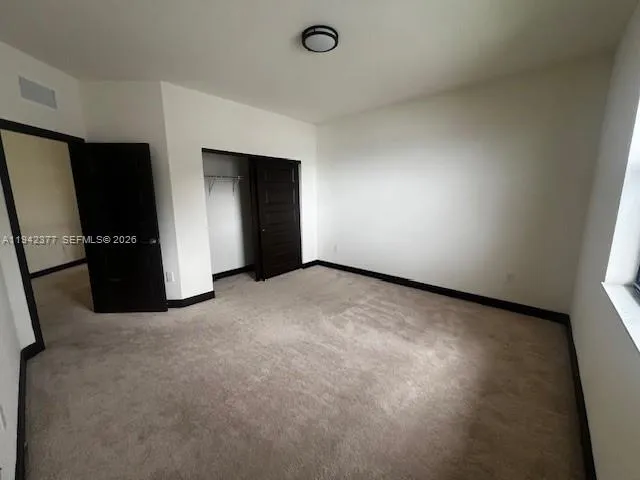 an empty room with closet