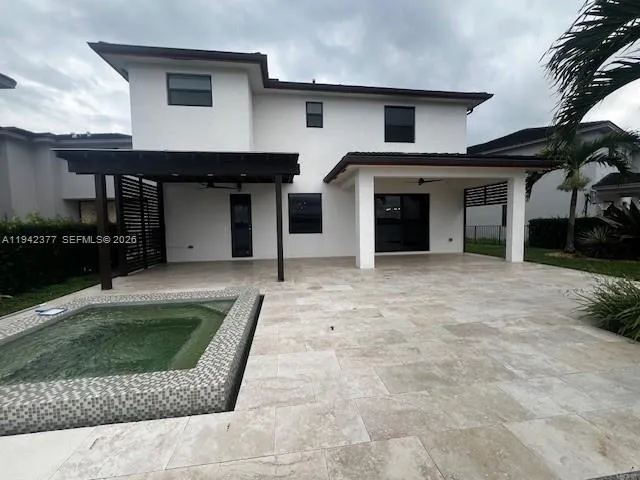 a house view with a backyard space