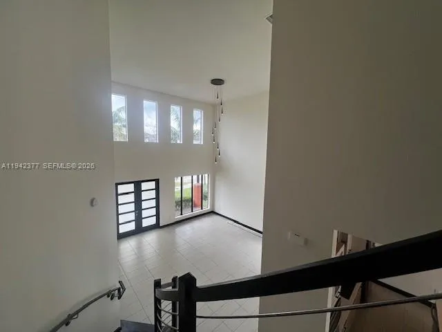 a view of an empty room with windows