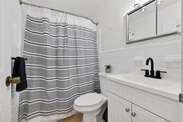 a bathroom with a sink and a toilet