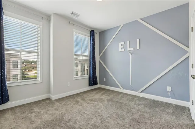 a view of an empty room with stairs