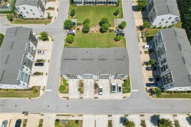 an aerial view of residential houses with outdoor space