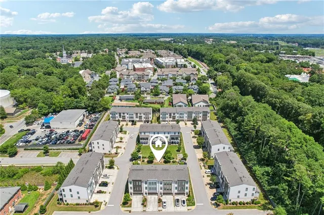 an aerial view of residential houses with outdoor space