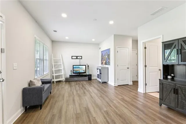 a view of kitchen with furniture and wooden floor