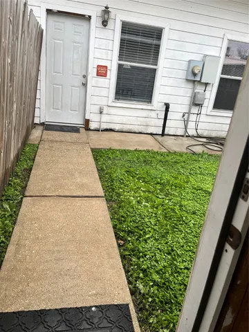 a backyard of a house with lots of green space
