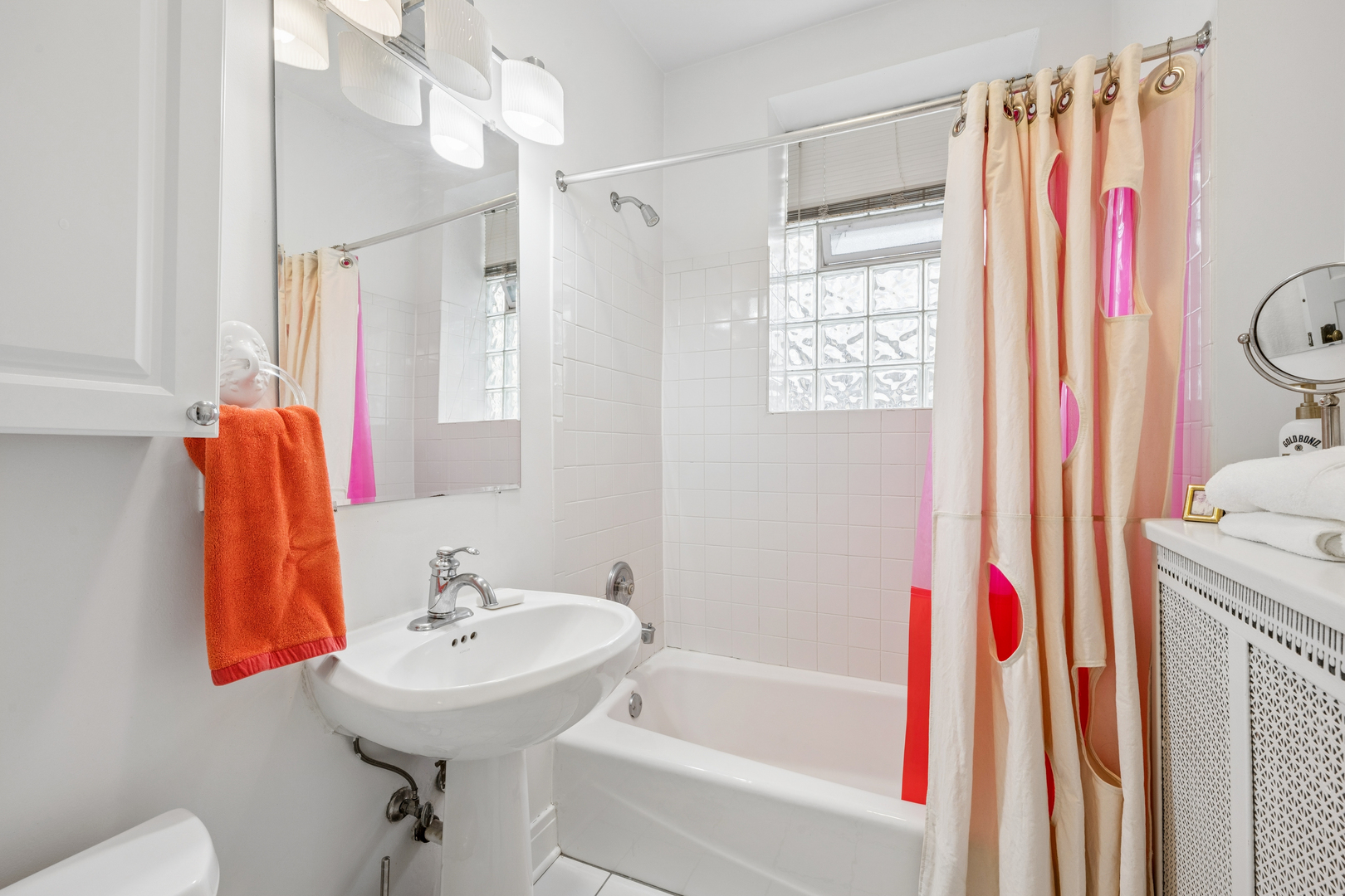 508 Lee Street, Unit 2E Evanston, IL 60202 - Photo 14 of 16 a bathroom with a sink and a shower curtain