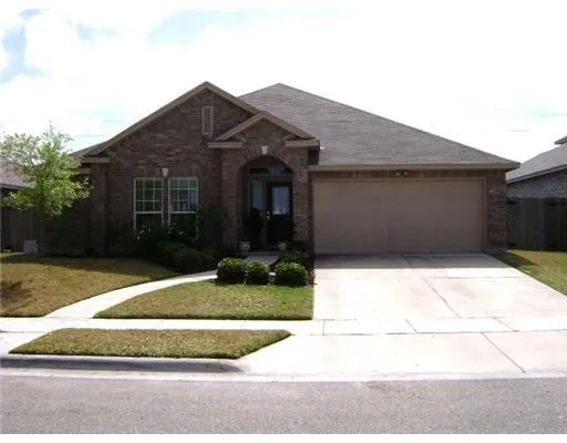 a front view of house with garage and yard