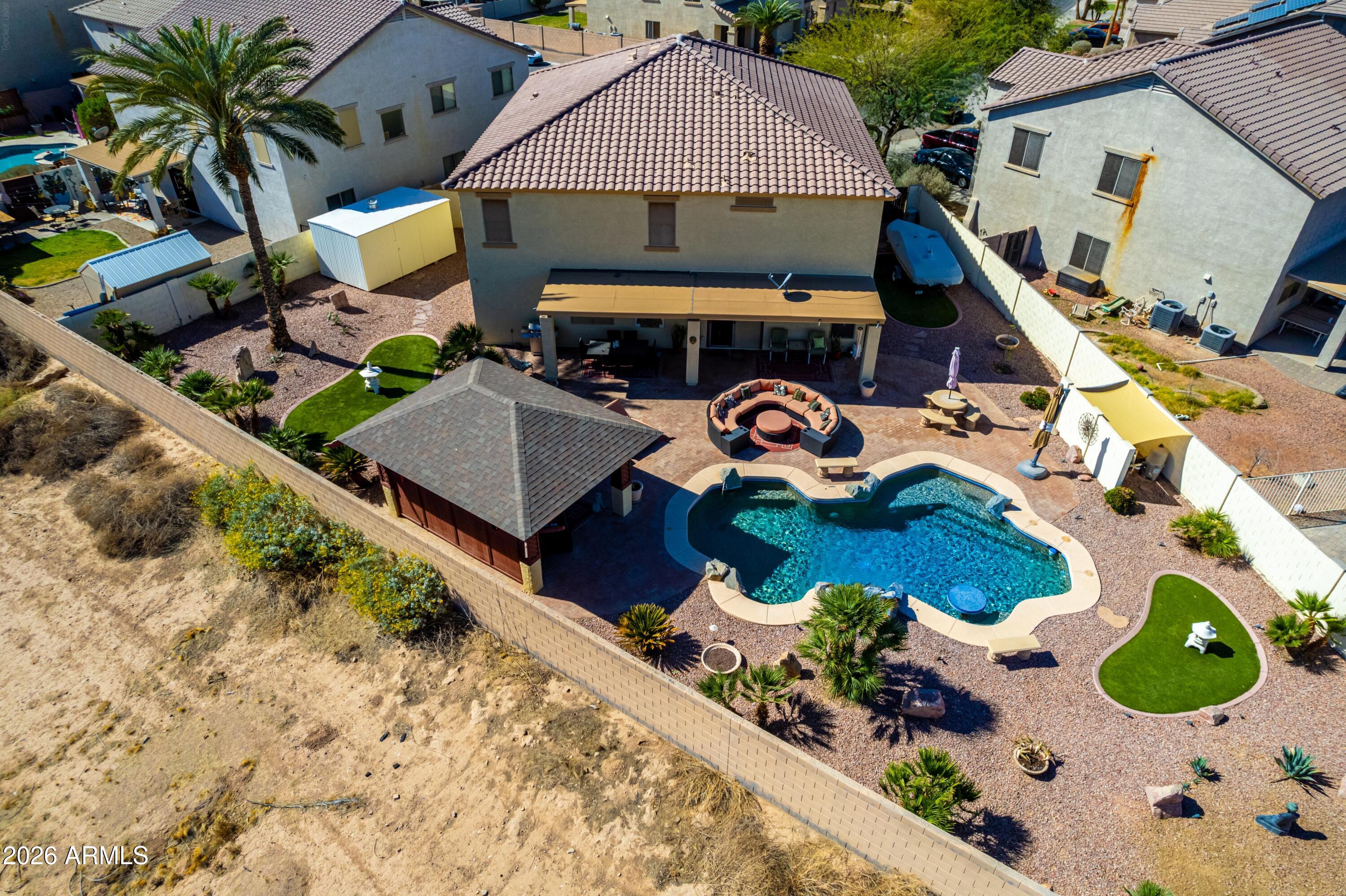 19221 North Toya Street Maricopa, AZ 85138 - Photo 2 of 22 an aerial view of a house with a swimming pool