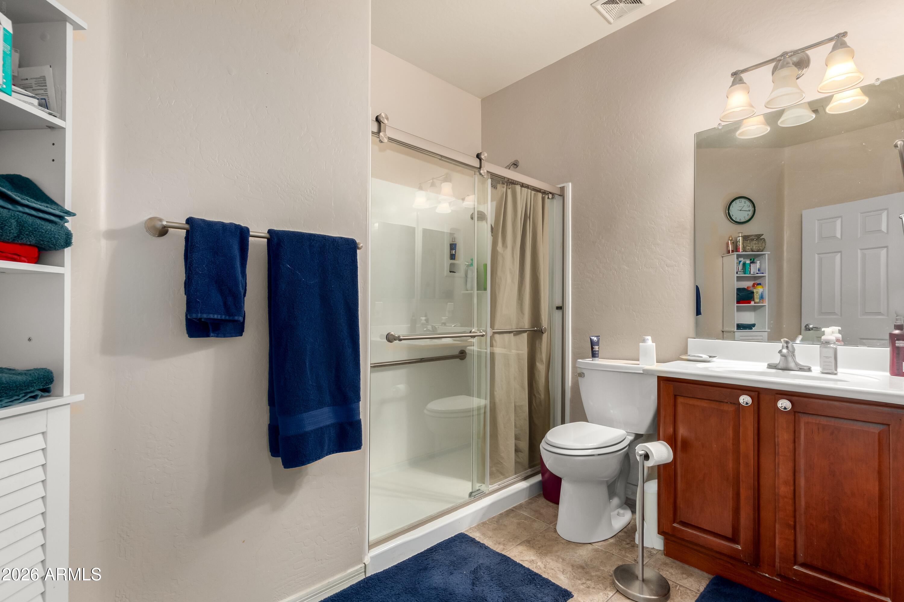 19221 North Toya Street Maricopa, AZ 85138 - Photo 22 of 22 a bathroom with a sink and a mirror