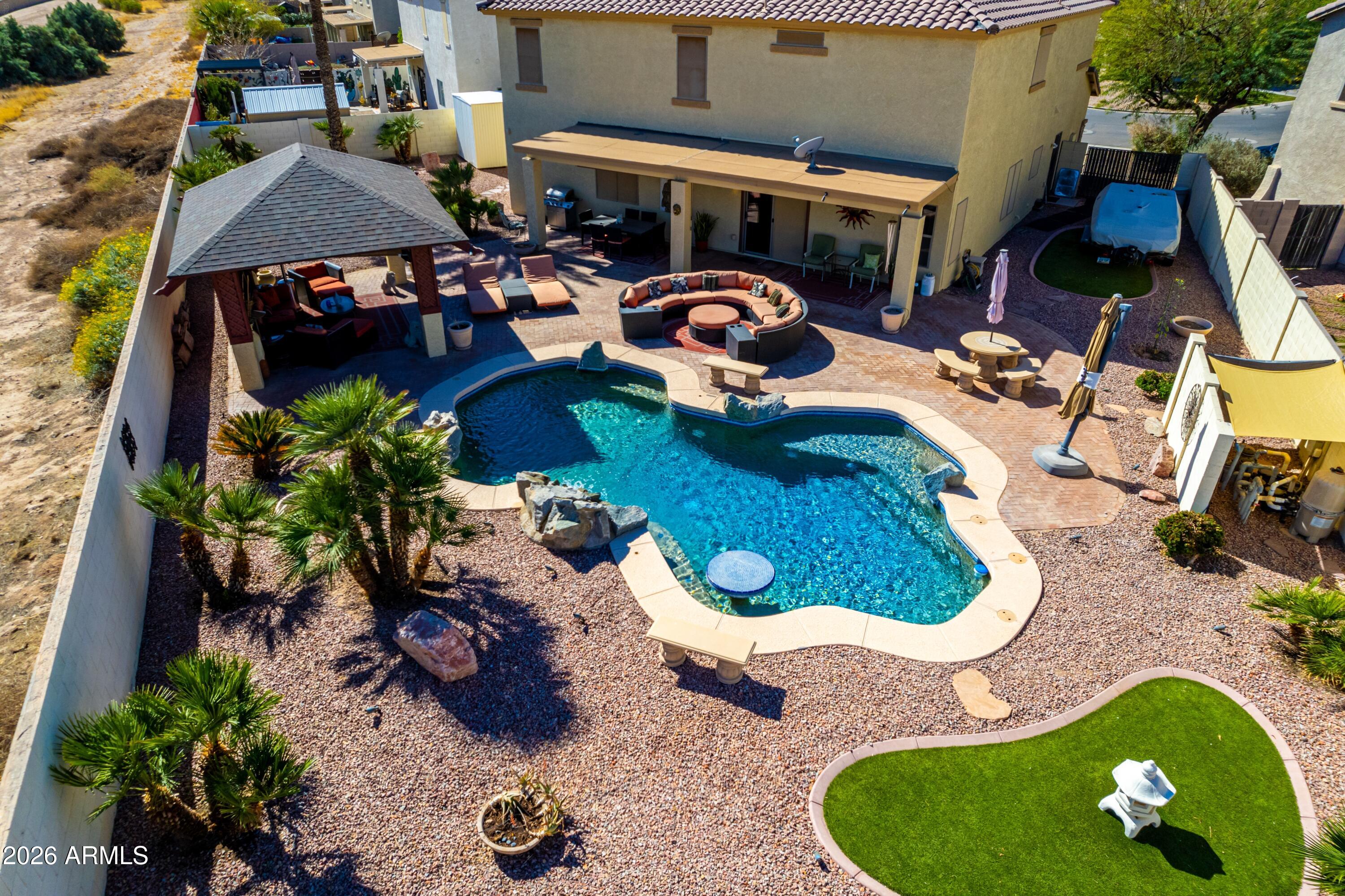 19221 North Toya Street Maricopa, AZ 85138 - Photo 4 of 22 an aerial view of a house with garden space and sitting area