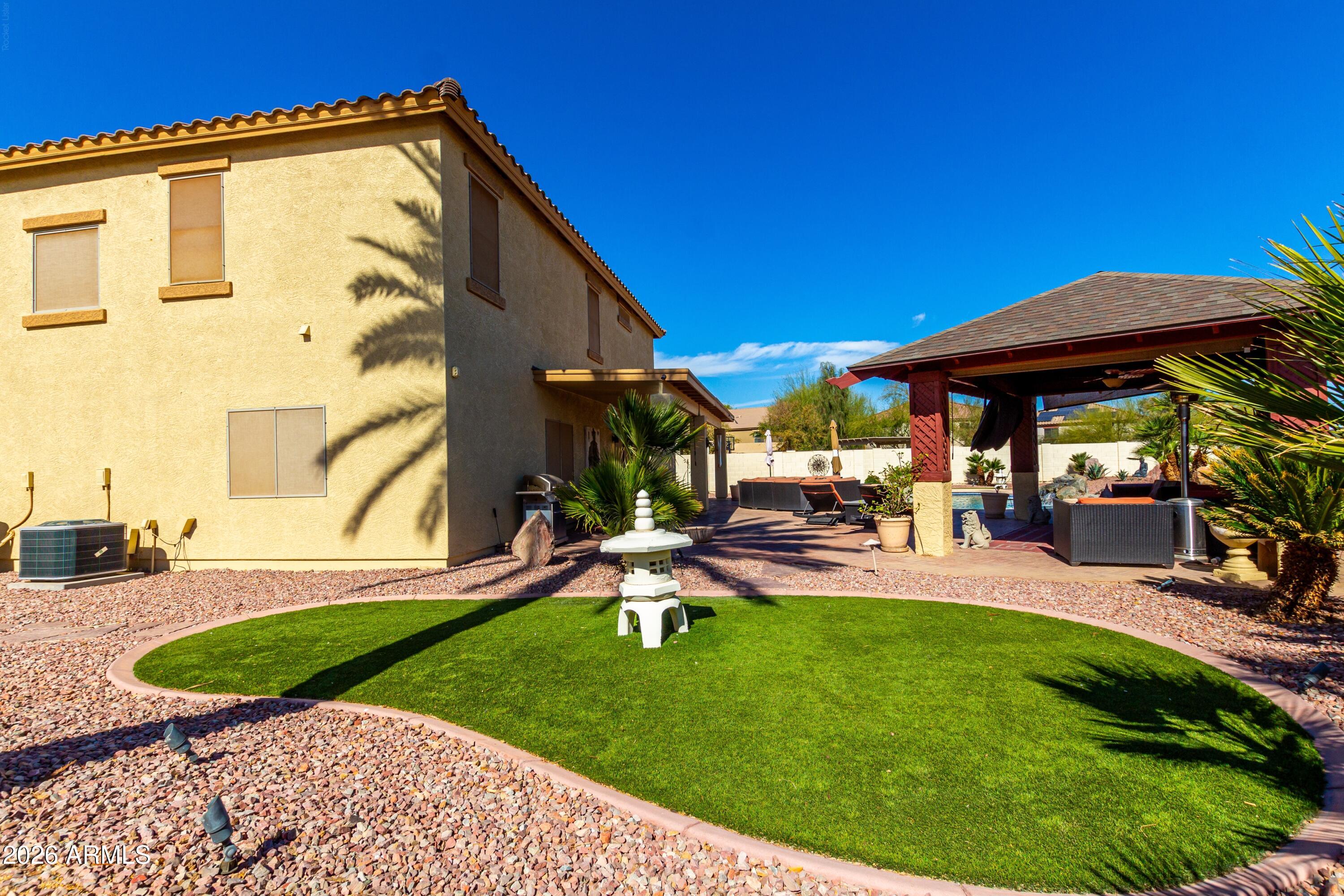 19221 North Toya Street Maricopa, AZ 85138 - Photo 8 of 22 a view of a backyard with sitting area