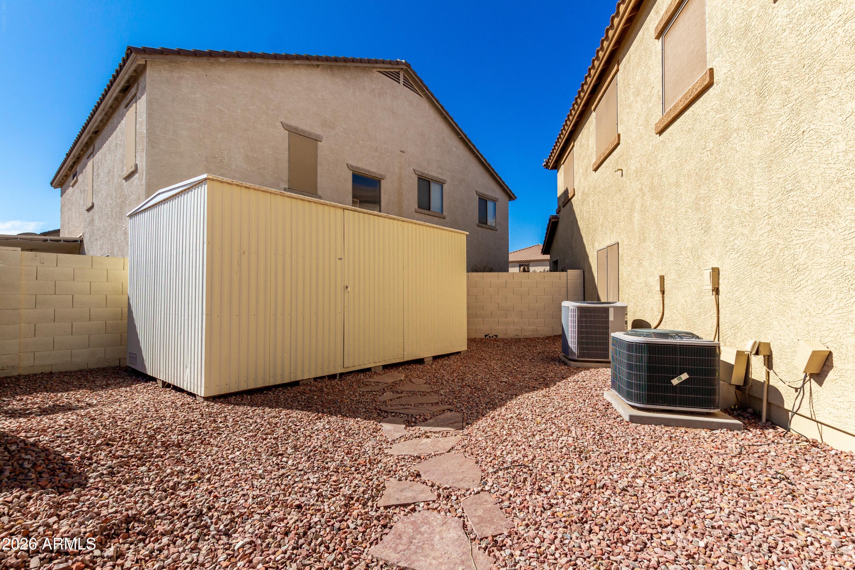 19221 North Toya Street Maricopa, AZ 85138 - Photo 9 of 22 a view of a house with a backyard
