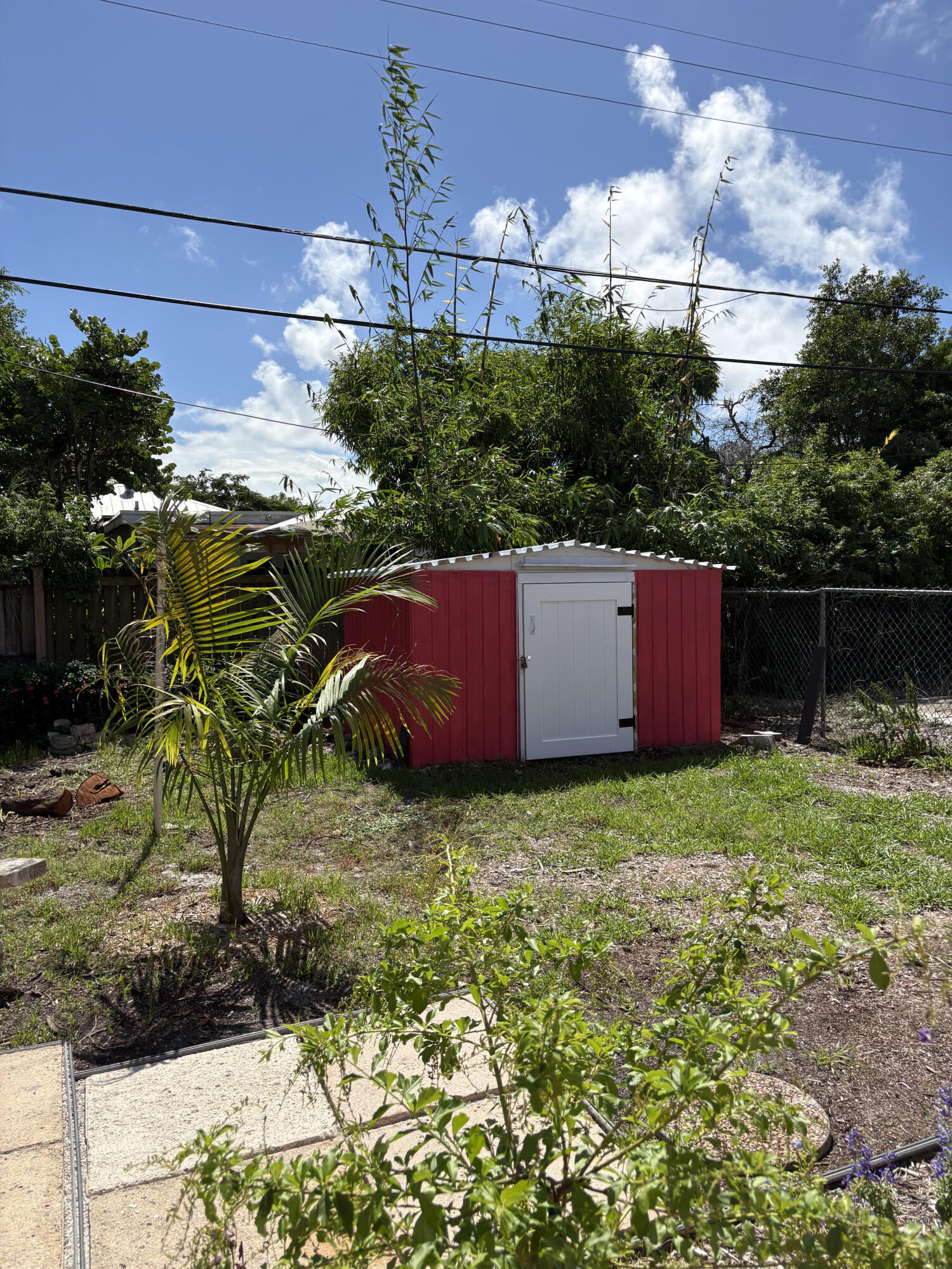 626 Minnesota Street Lantana, FL 33462 - Photo 13 of 15 a backyard of a house with lots of green space