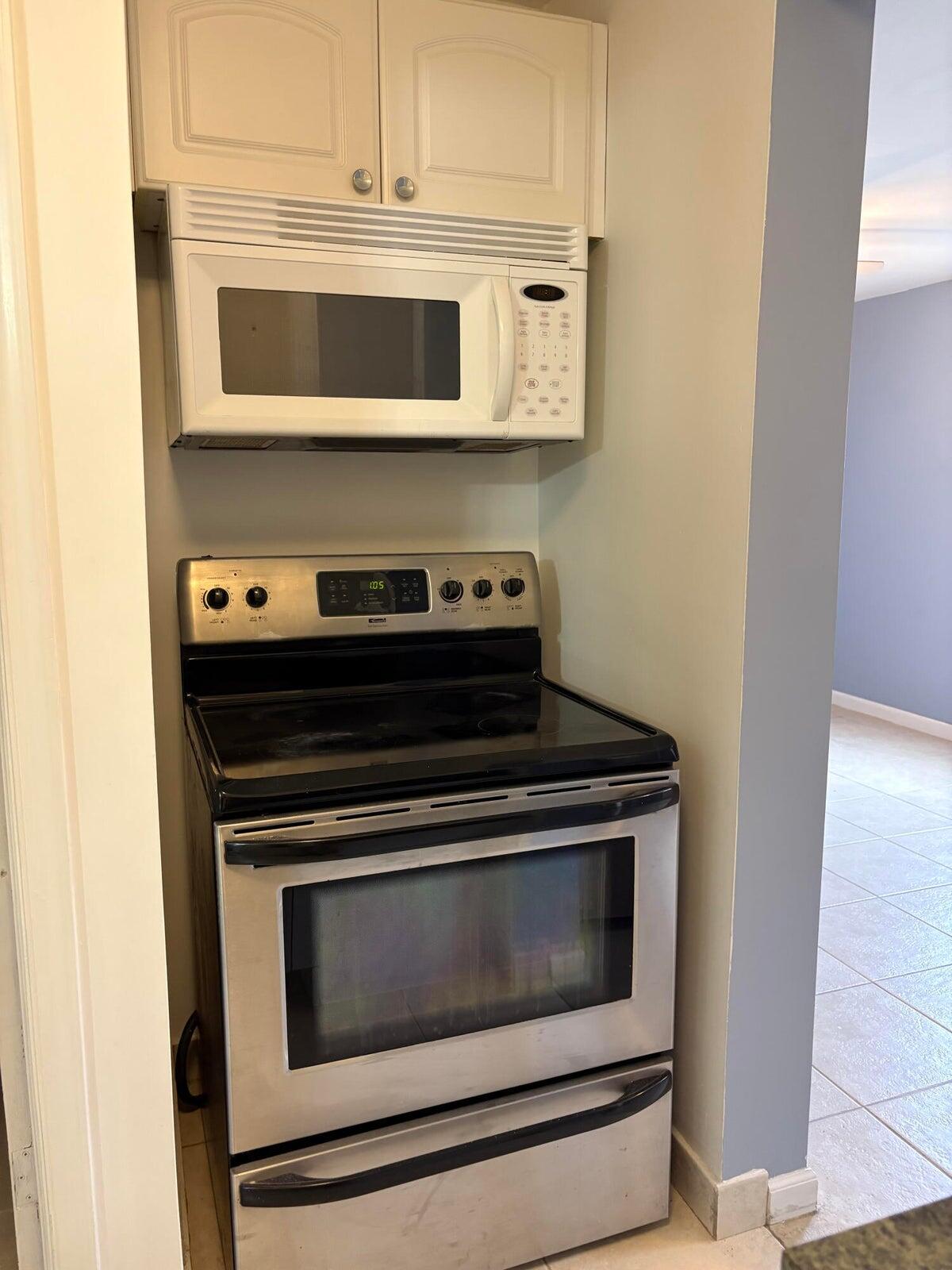 626 Minnesota Street Lantana, FL 33462 - Photo 10 of 15 a stove top oven sitting inside of a kitchen
