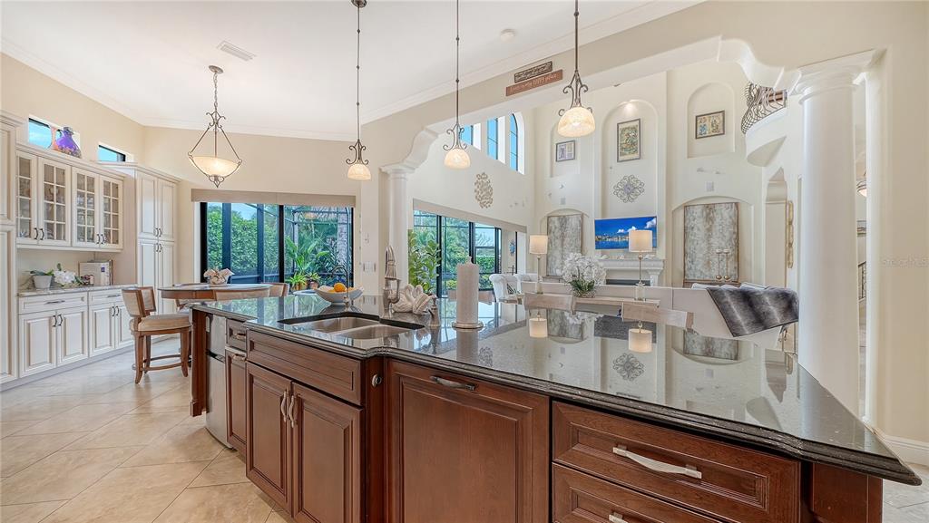1630 Assisi Drive, Unit 18 Sarasota, FL 34231 - Photo 11 of 42 a kitchen with counter top space a sink and appliances