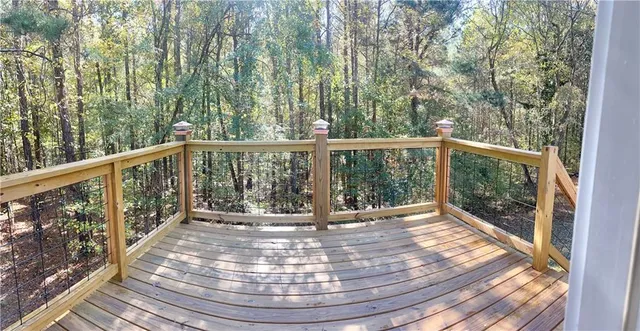 a view of balcony with wooden floor