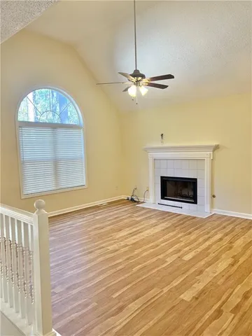a view of empty room with a fireplace