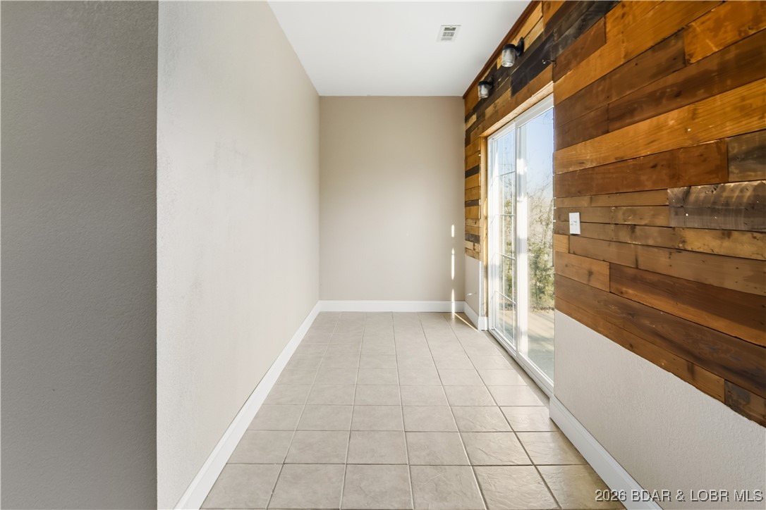 22 Navajo Road Four Seasons, MO 65049 - Photo 13 of 42 The lower sliding doors lead to a small concrete p