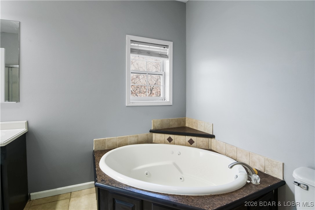 22 Navajo Road Four Seasons, MO 65049 - Photo 18 of 42 Unwind after the day is done with a long bath.