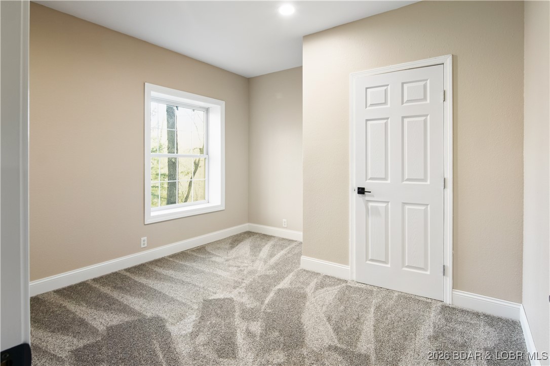 22 Navajo Road Four Seasons, MO 65049 - Photo 31 of 42 Downstairs Guest bedroom? Office space? Kids play