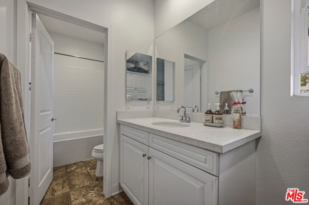 3065 Gibson Street Riverside, CA 92503 - Photo 13 of 15 a bathroom with a sink toilet and shower
