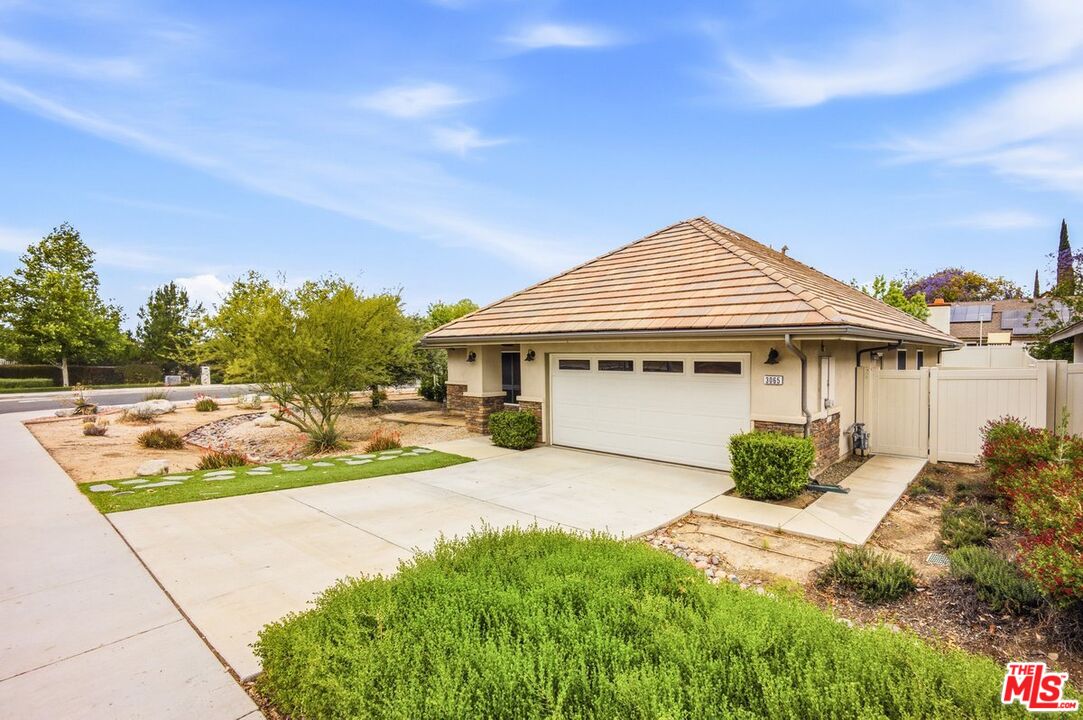 3065 Gibson Street Riverside, CA 92503 - Photo 2 of 15 a front view of a house with yard and green space