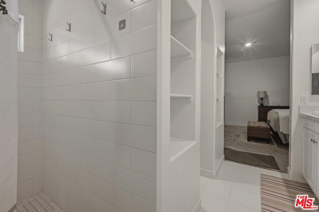 3065 Gibson Street Riverside, CA 92503 - Photo 4 of 15 a bathroom with a sink and mirror