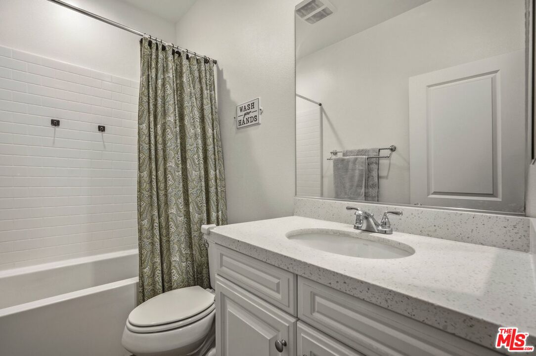 3065 Gibson Street Riverside, CA 92503 - Photo 7 of 15 a bathroom with a sink toilet and shower