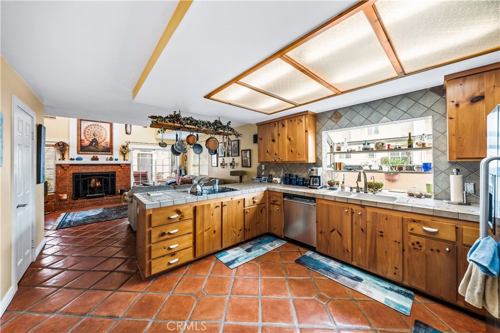 427 21st Street Huntington Beach, CA 92648 - Photo 12 of 63 a kitchen with stainless steel appliances granite countertop a sink and cabinets