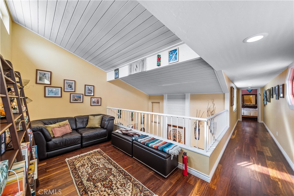 427 21st Street Huntington Beach, CA 92648 - Photo 25 of 63 a living room with furniture and a wooden floor