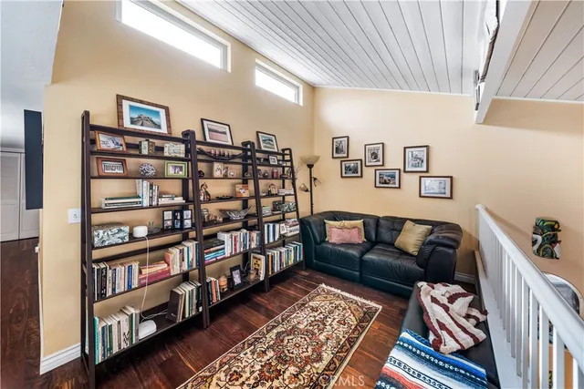 a room with two mirror and furniture